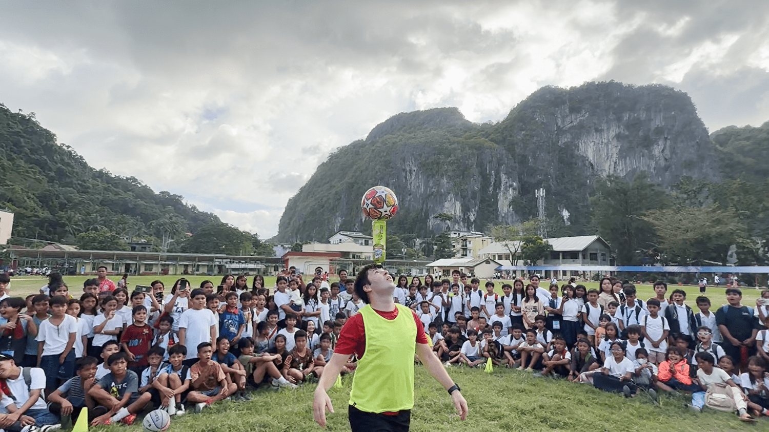 A student joins the football demonstration